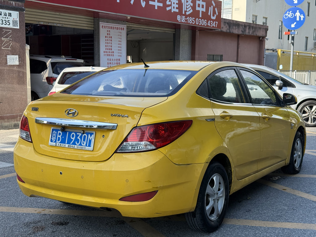 2010 Hyundai Verna Yellow Sedan - Front 3/4 View