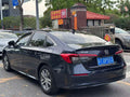 Honda Civic 2023 rear three-quarter view - blue