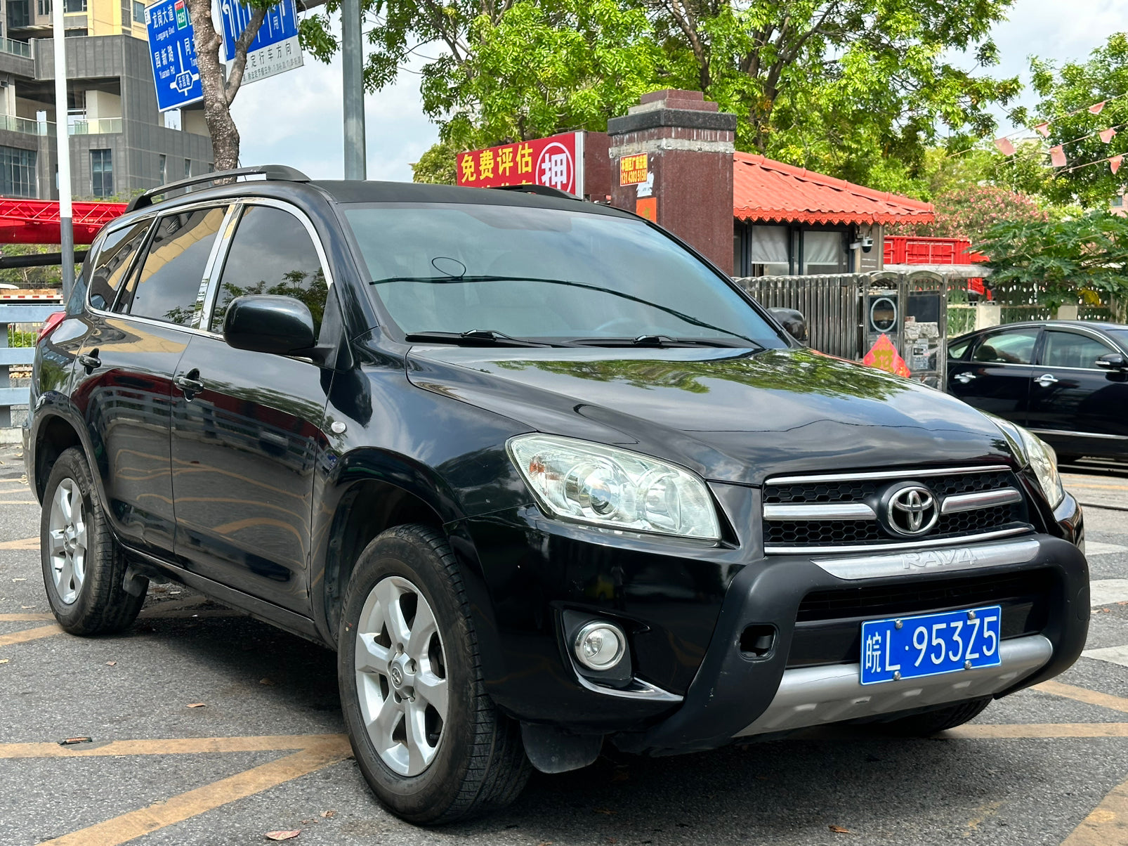 2011 Toyota RAV4 black - rear three-quarter view