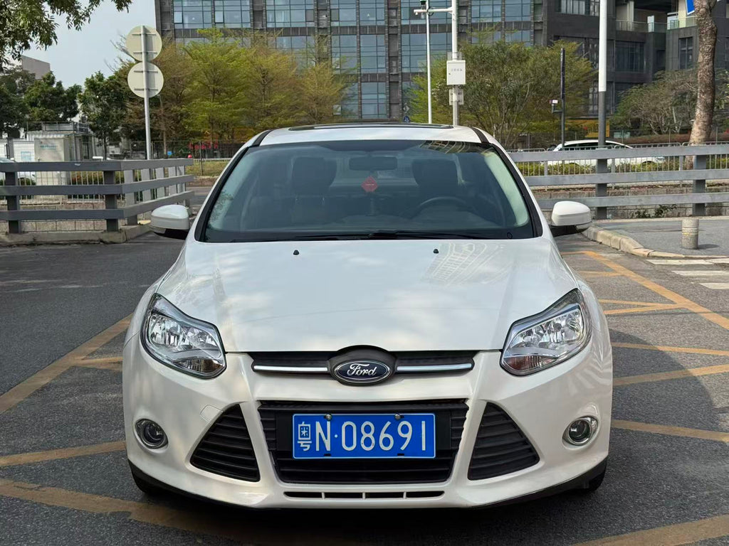 Ford Focus 2012 front view - white compact sedan FOB Shenzhen export