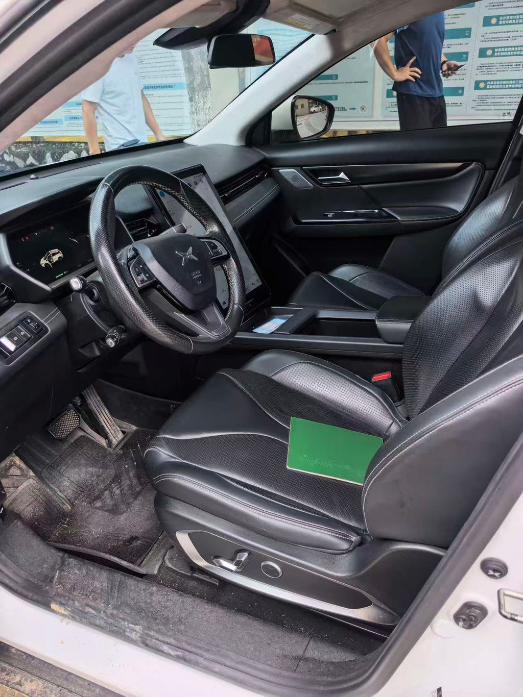 Xpeng G3 driver seat and dashboard interior view