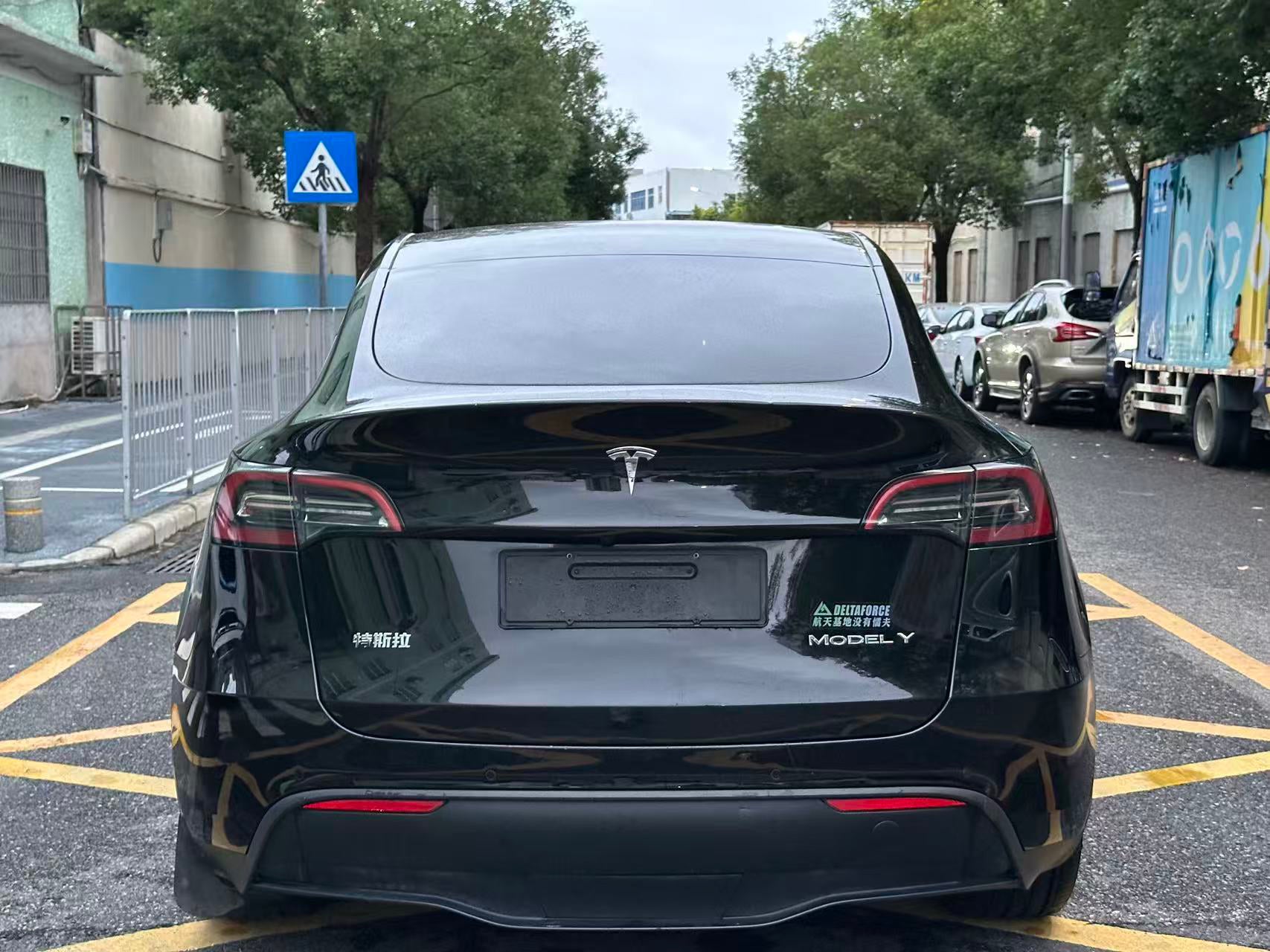Tesla Model Y 2022 rear three-quarter view black