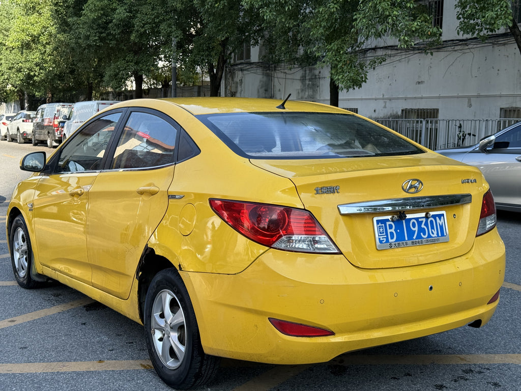 2010 Hyundai Verna Yellow Sedan - Rear View 2