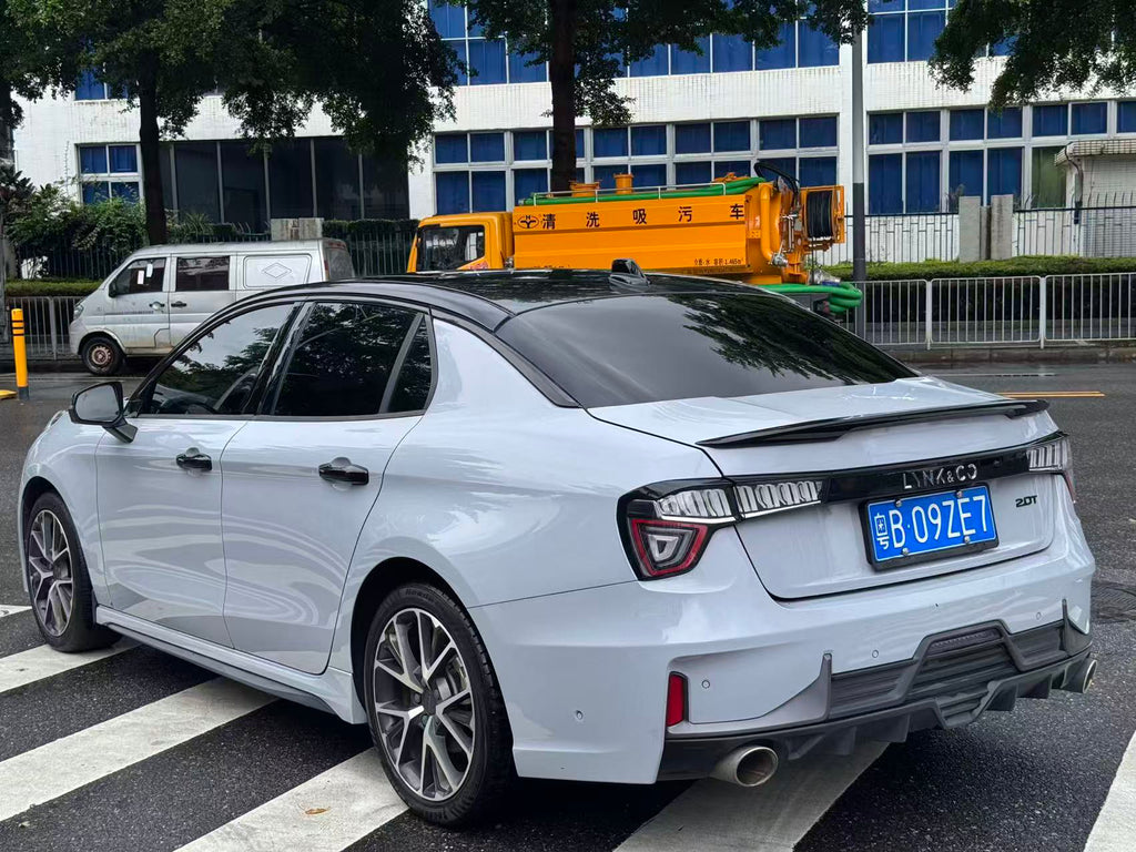 2021 Lynk & Co 03 Champion Edition - Rear 3/4 view, Cigarette Grey