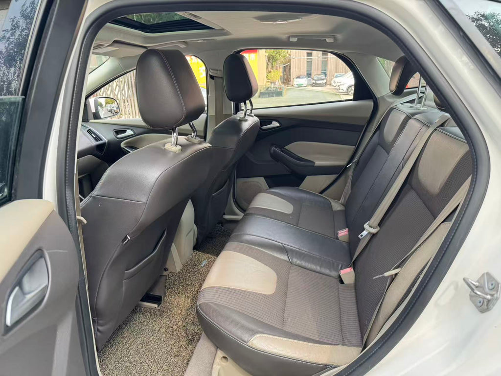 Ford Focus 2012 rear view - white sedan with Focus badge